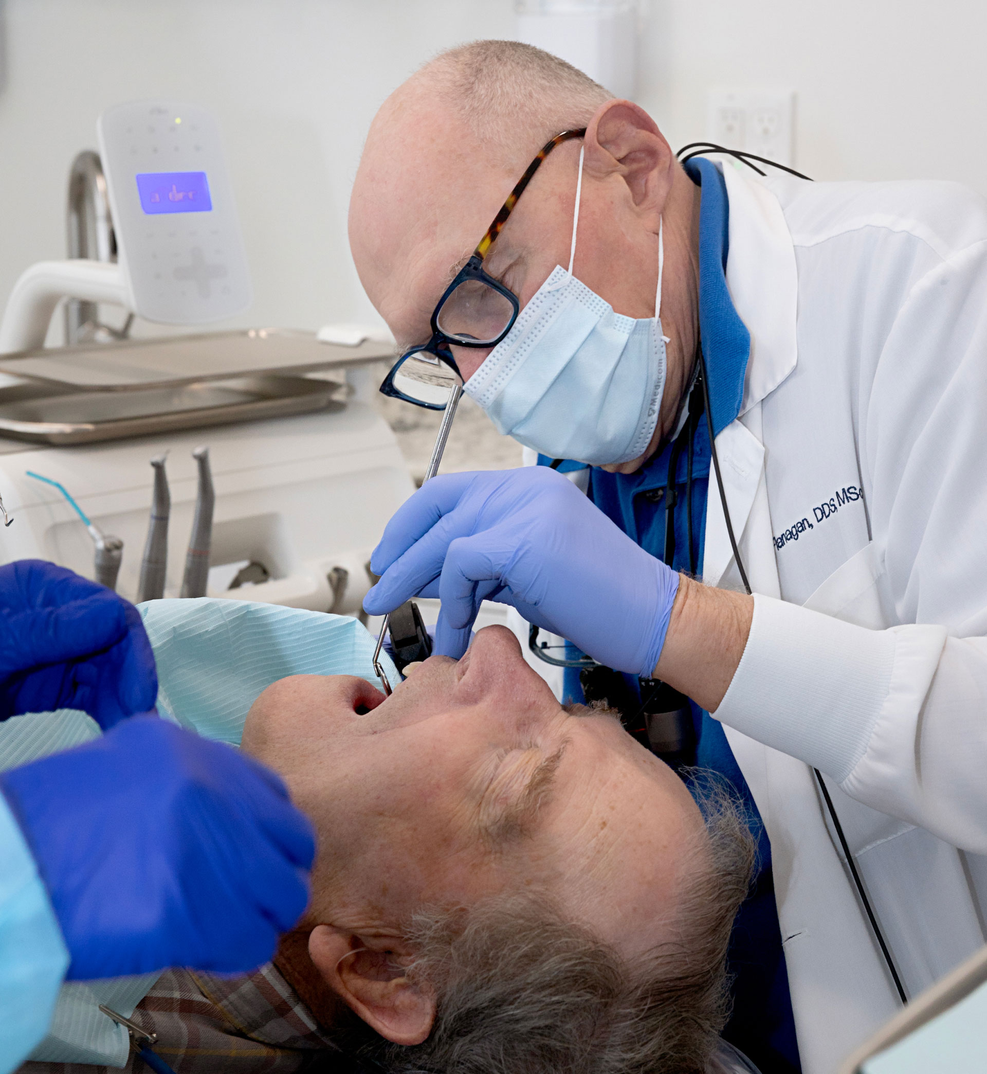 Dr. Flanagan performing dental exam on patient